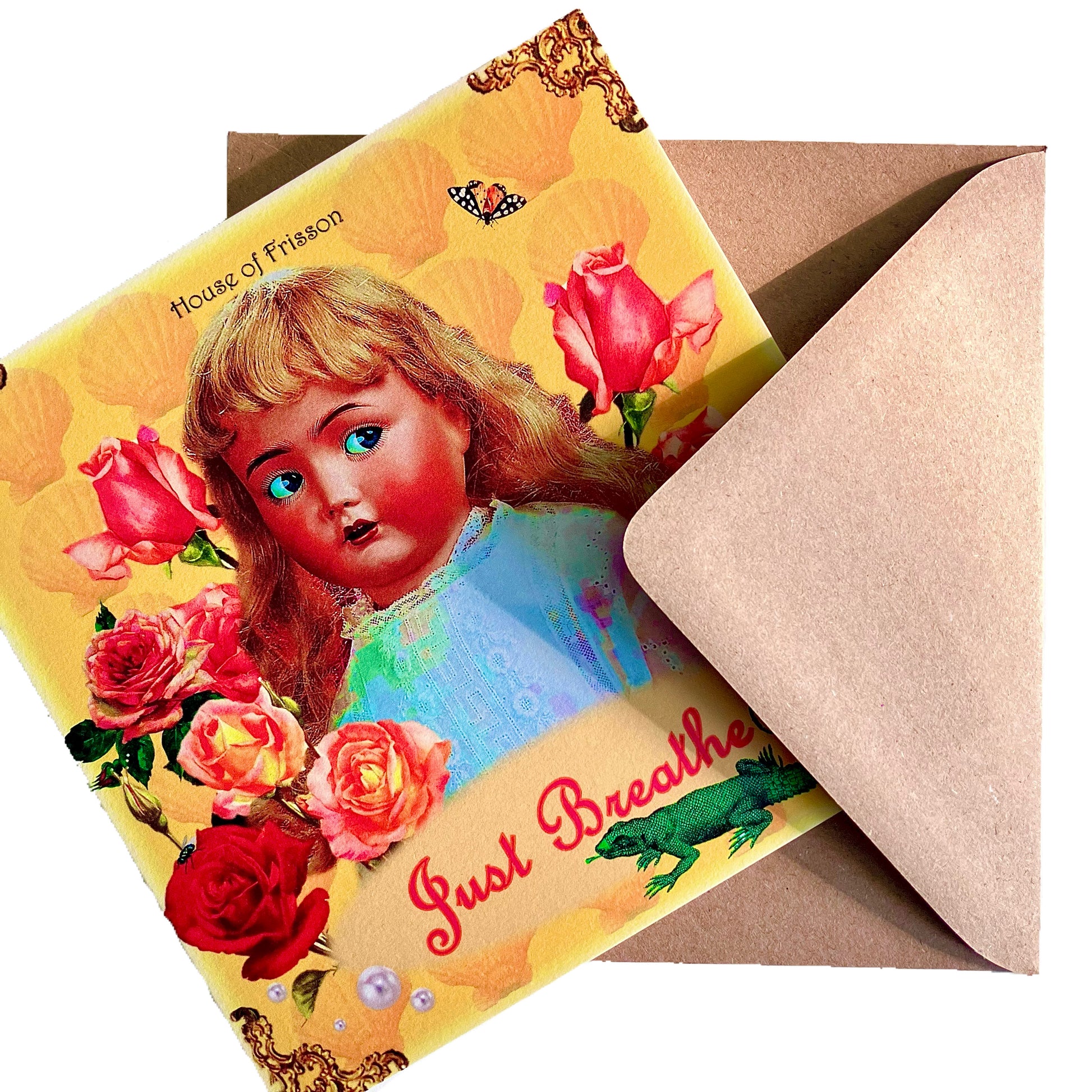 "Just Breathe" Greeting Card by House of Frisson. Featuring a vintage doll surrounded by roses, pearls, a moth, and a lizard, on a yellow background.