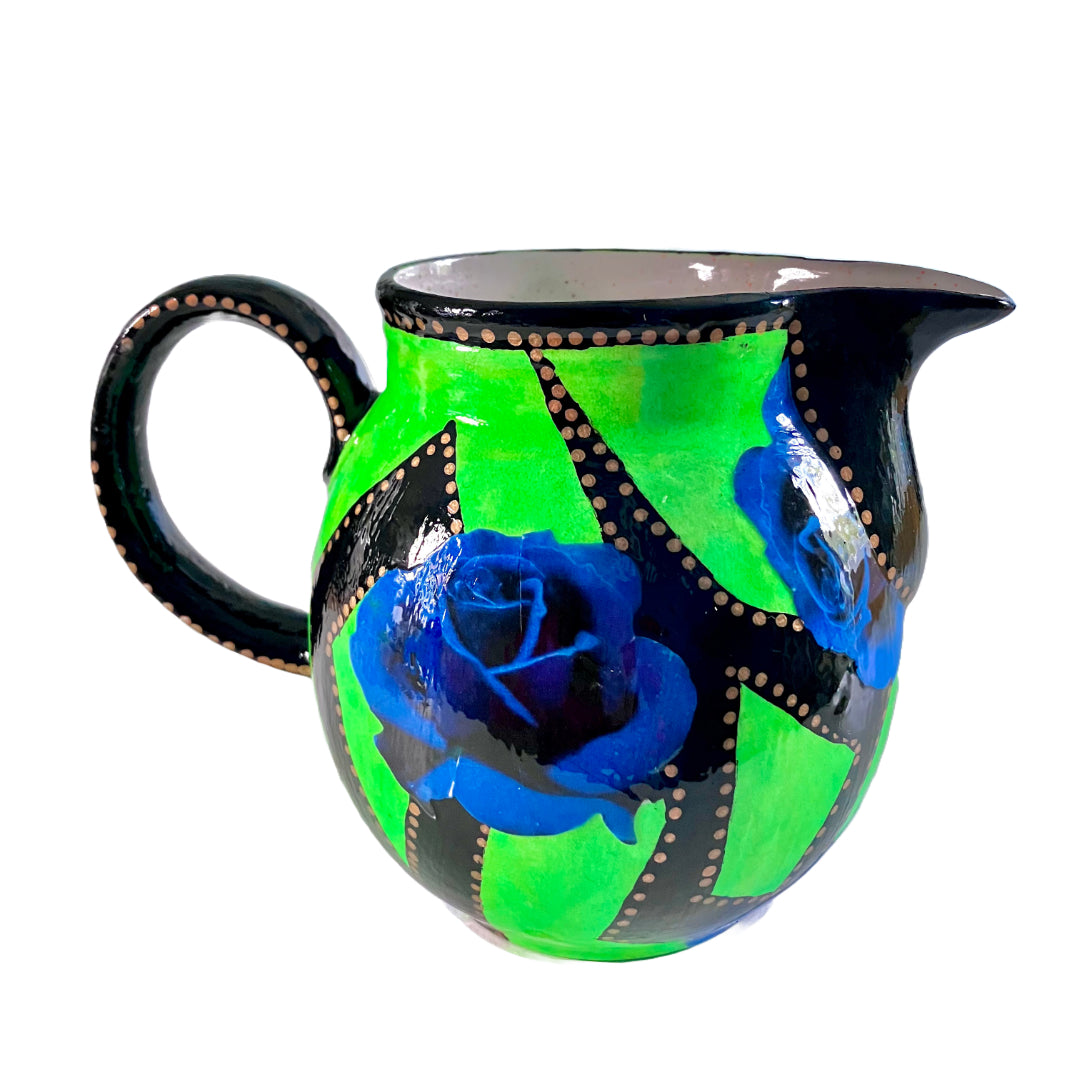 Neon Green upcycled Pitcher/Vase by House of Frisson, featuring some graphics in black and blue roses, beautifully contrasting with the bright green background.