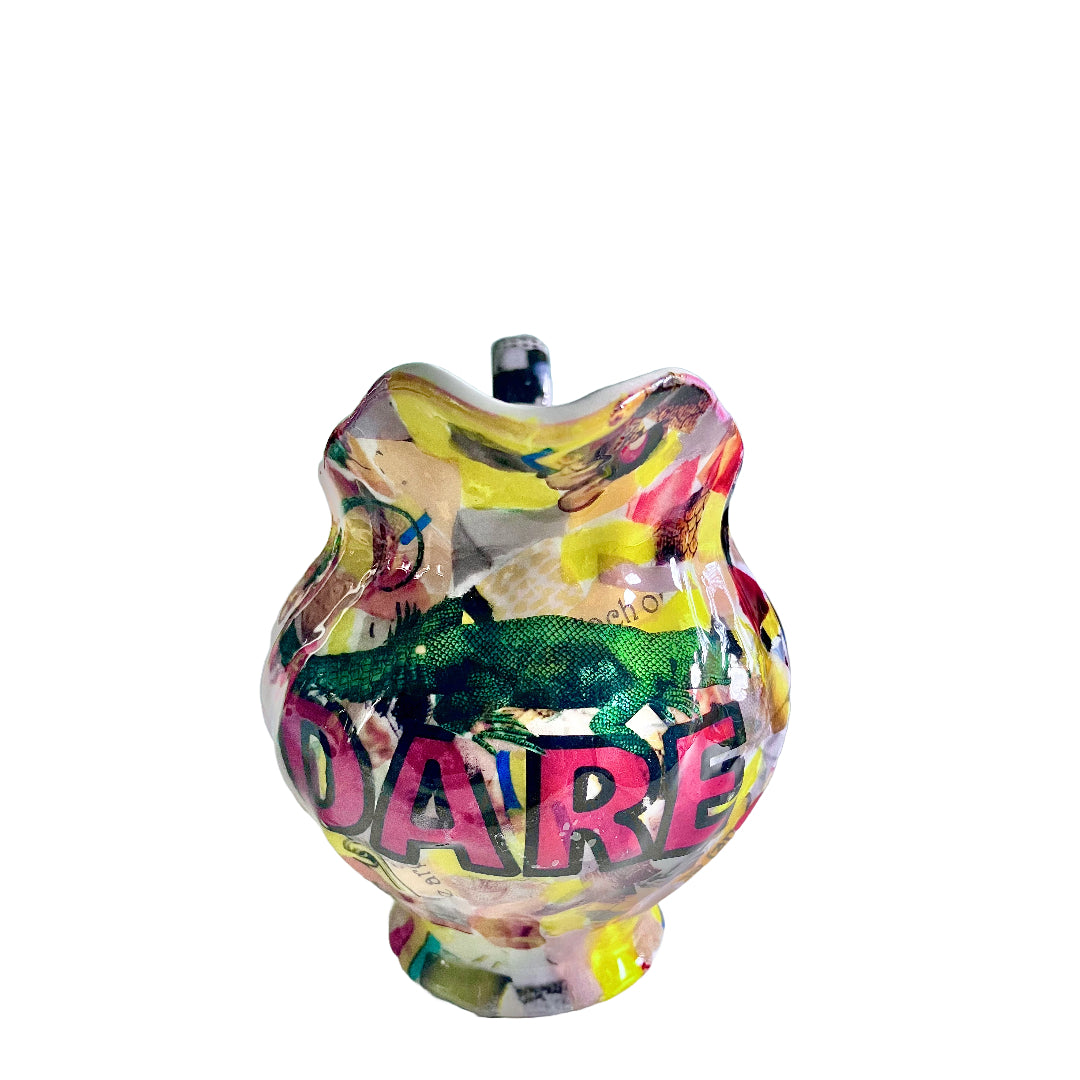 "Dare" Flower Vase/Jug by House of Frisson, featuring a colourful collage of scrap papers, the word Dare, and a lizard. Showing front of the jug.