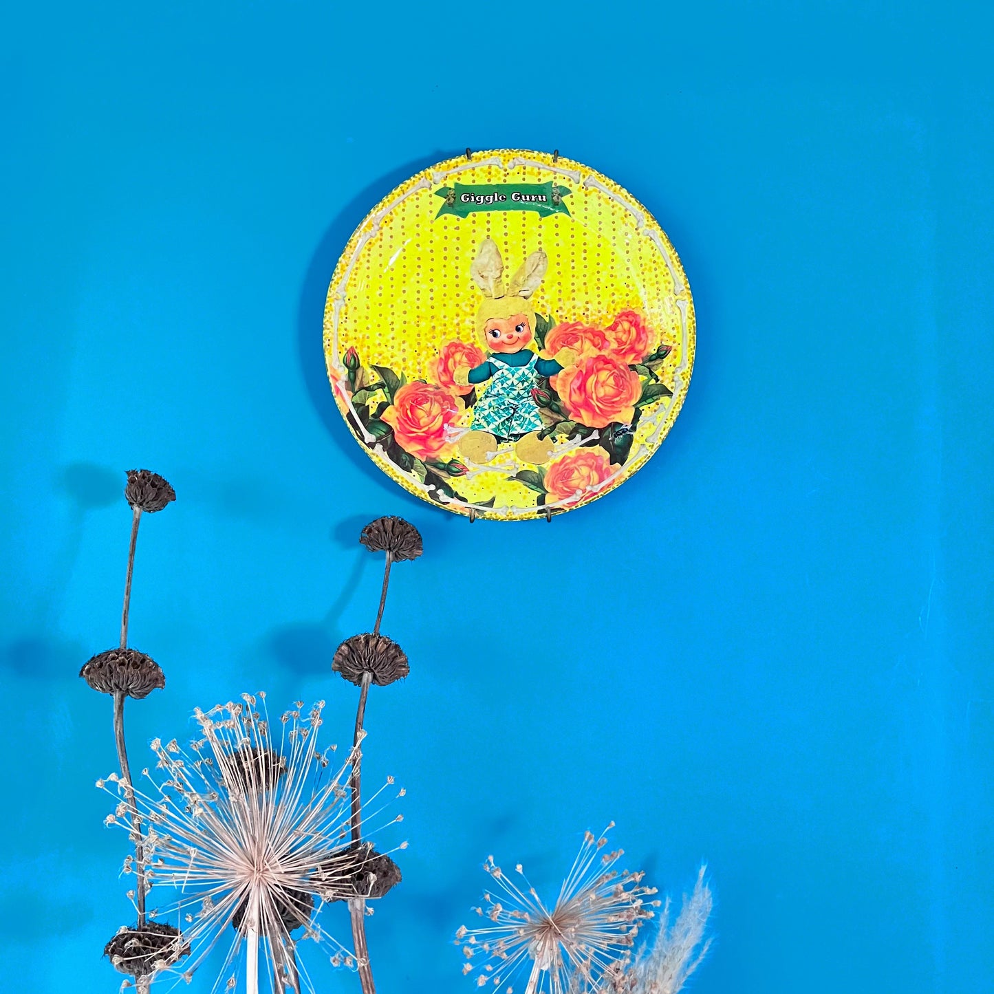 "Giggle Guru" Neon Yellow Wall Plate by House of Frisson, featuring a vintage bunny, roses, bones, and House of Frisson's signature fly. 