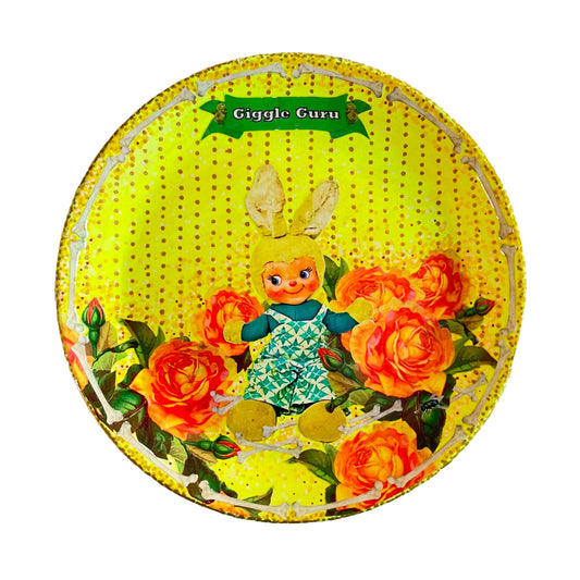 "Giggle Guru" Neon Yellow Wall Plate by House of Frisson, featuring a vintage bunny, roses, bones, and House of Frisson's signature fly. 