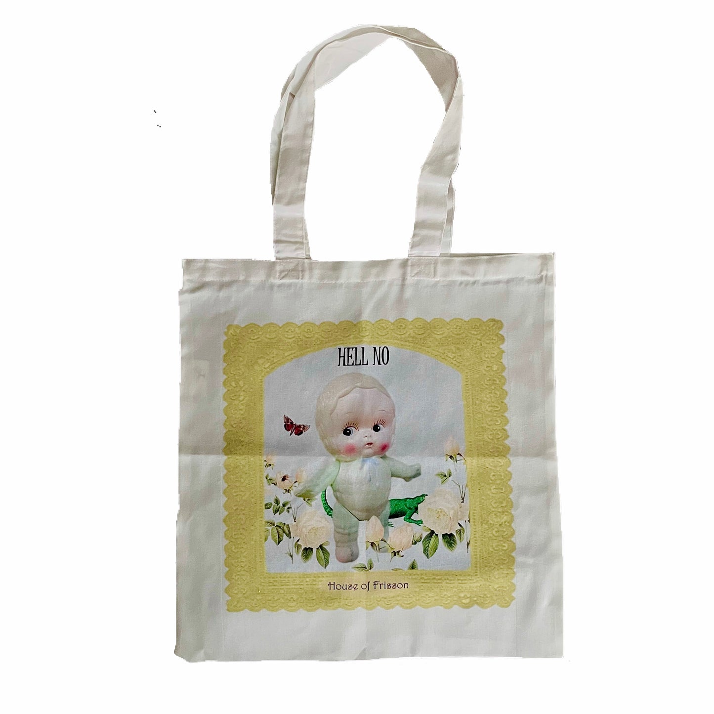 "Hell No" Tote Bag product photo by House of Frisson. Featuring a vintage kitsch plastic doll surrounded by flowers, a moth, and a lizard, framed by a yellow crochet.