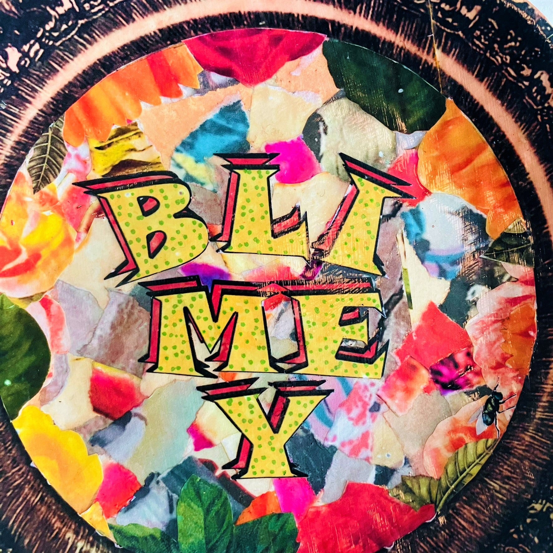 "Blimey" Wall Plate by House of Frisson, featuring a collage of word "blimey" framed with a vintage looking frame, with colourful background. Closeup detail showing the word "blimey".