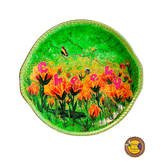 "Cheeky" Wall Plate by House of Frisson, featuring a collage with letters coming out of flowers forming the word "cheeky", and a lizard, on a green background.