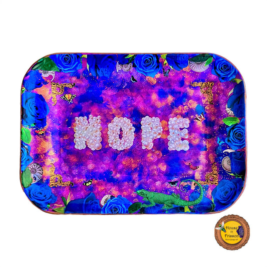 "Nope" Wall Plate by House of Frisson. Featuring the word "nope" written with pearls, framed by blue roses, shells, moths, and a lizard, on a  purple, blue and golden background.