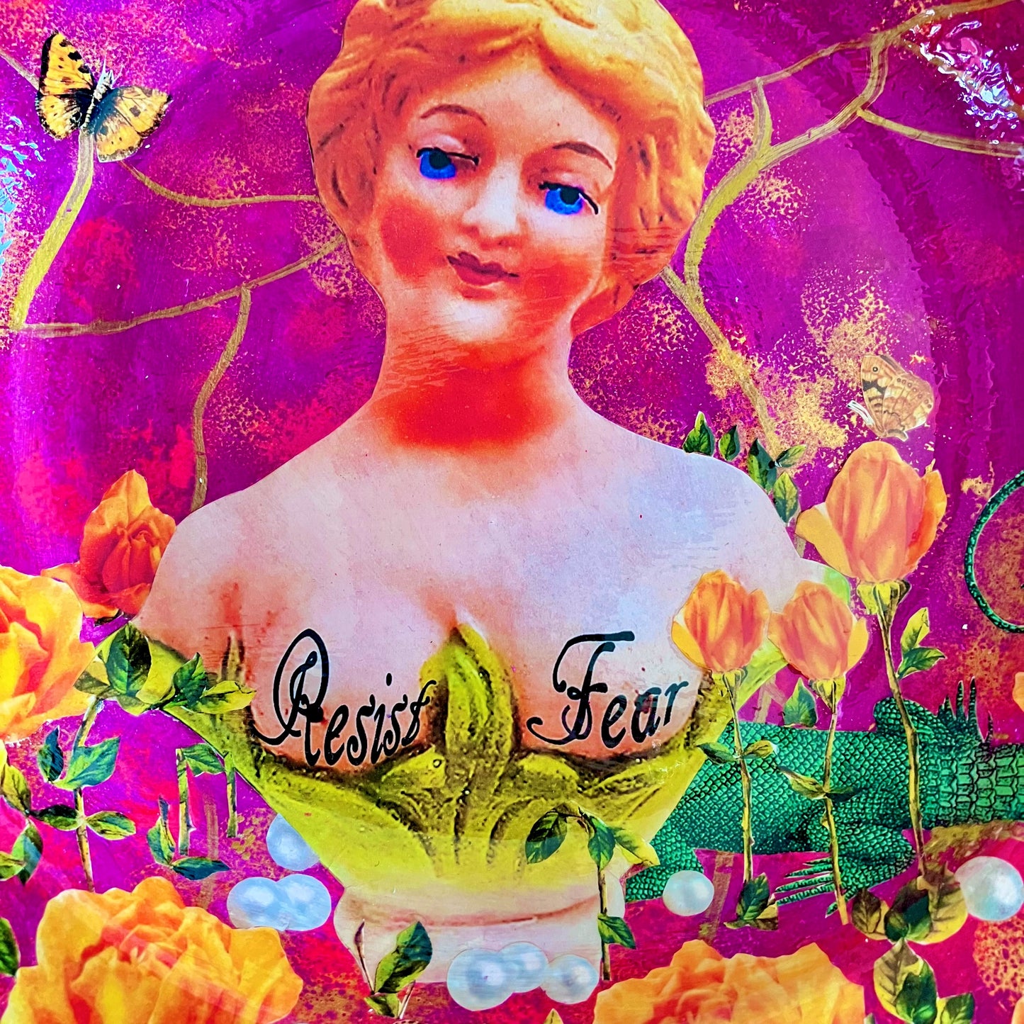 "Resist Fear" Wall Plate by House of Frisson, featuring a female bust statue with "Resist Fear" written across breasts, surrounded by flowers, and pearls, on a purple background. Closeup detail showing female statue against a purple background.