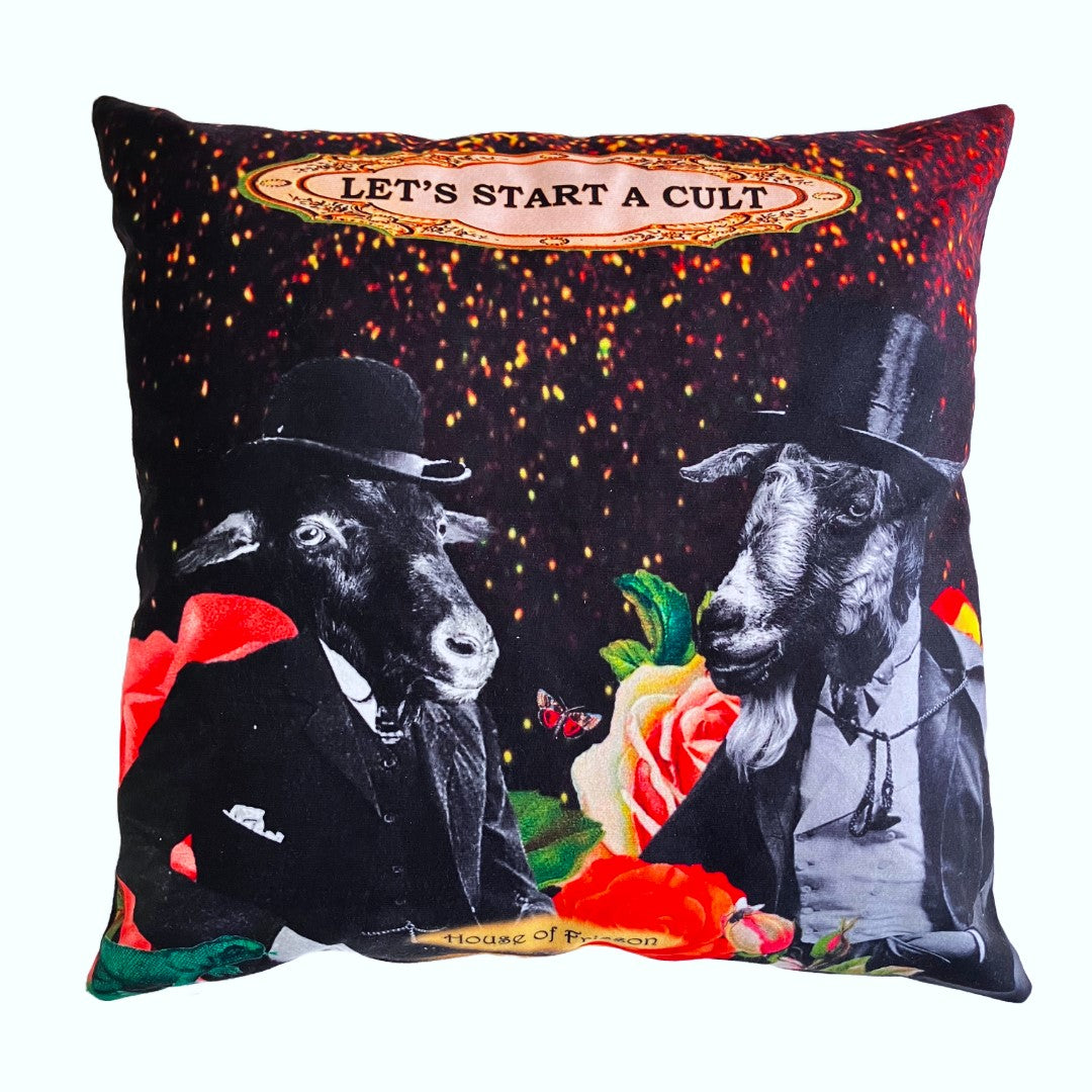 "Let's Start A Cult" Cushion Cover by House of Frisson, featuring a collage of two Victorian-dressed  glentlemen with goat heads, surrounded by colourful flowers, against a black background.