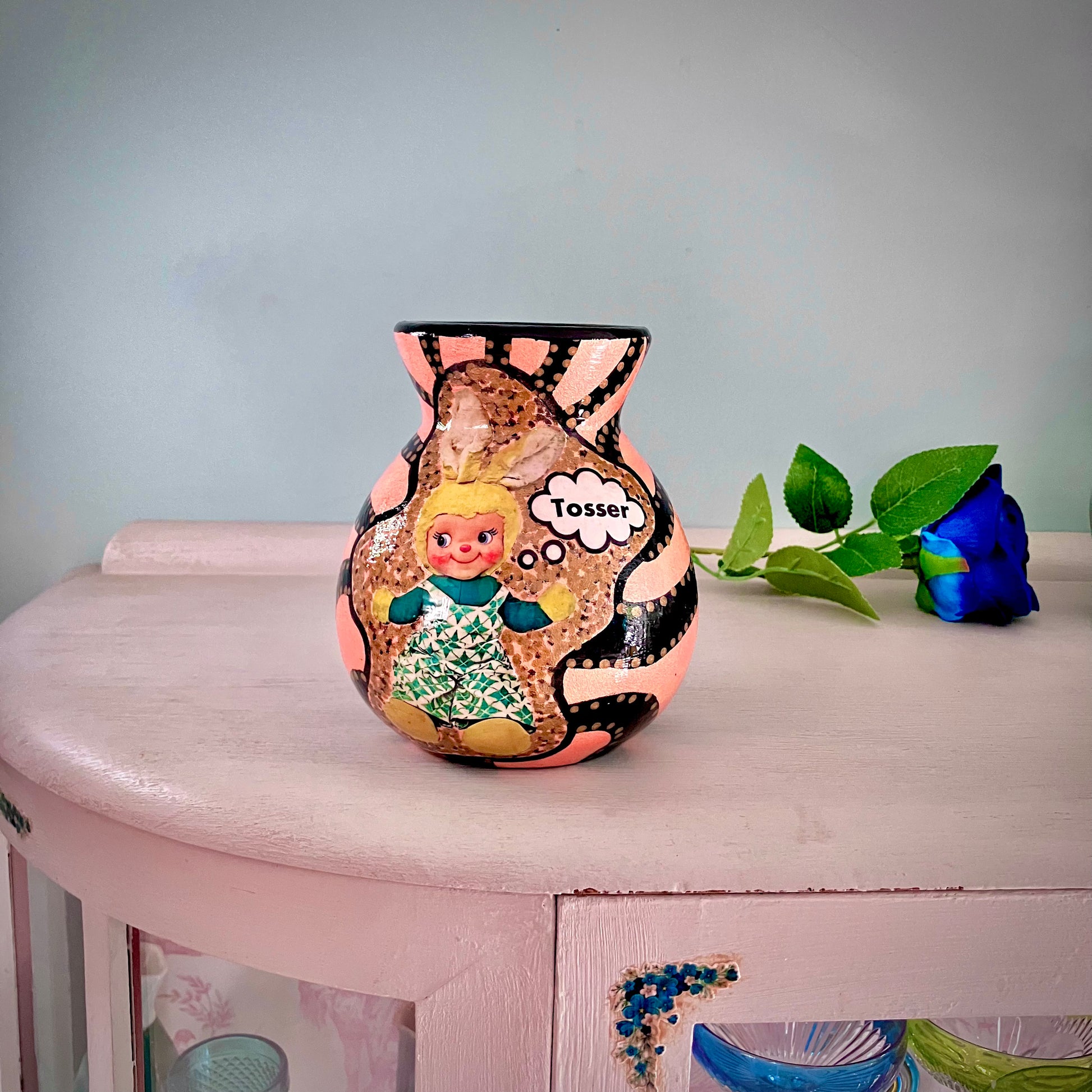 Peach Pink Upcycled Flower Vase by House of Frisson, featuring a black graphic design and a collage of a bunny doll saying "tosser". It's a conversation starter.