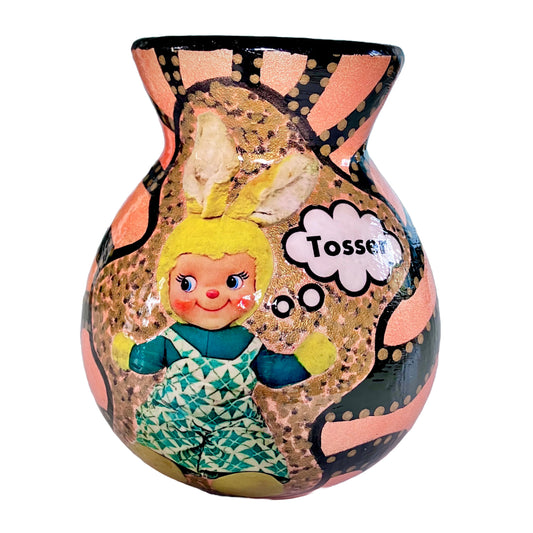 Peach Pink Upcycled Flower Vase by House of Frisson, featuring a black graphic design and a collage of a bunny doll saying "tosser". It's a conversation starter.