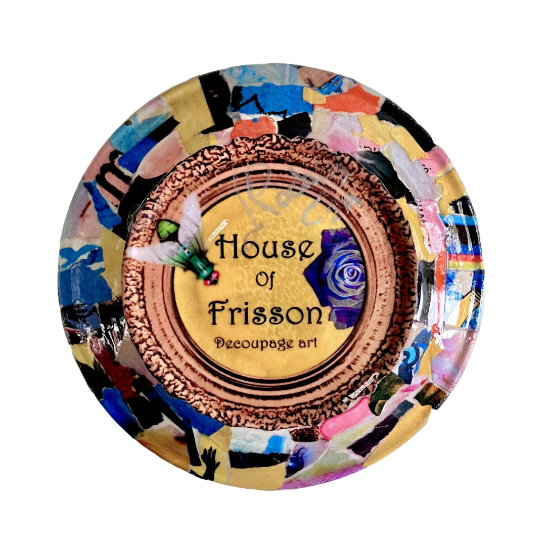 "Trash = Treasure" Trinket Dish by House of Frisson. Featuring a collage of a moth with a doll head, framed with blue roses. Showing back of the dish with House of Frisson's logo.