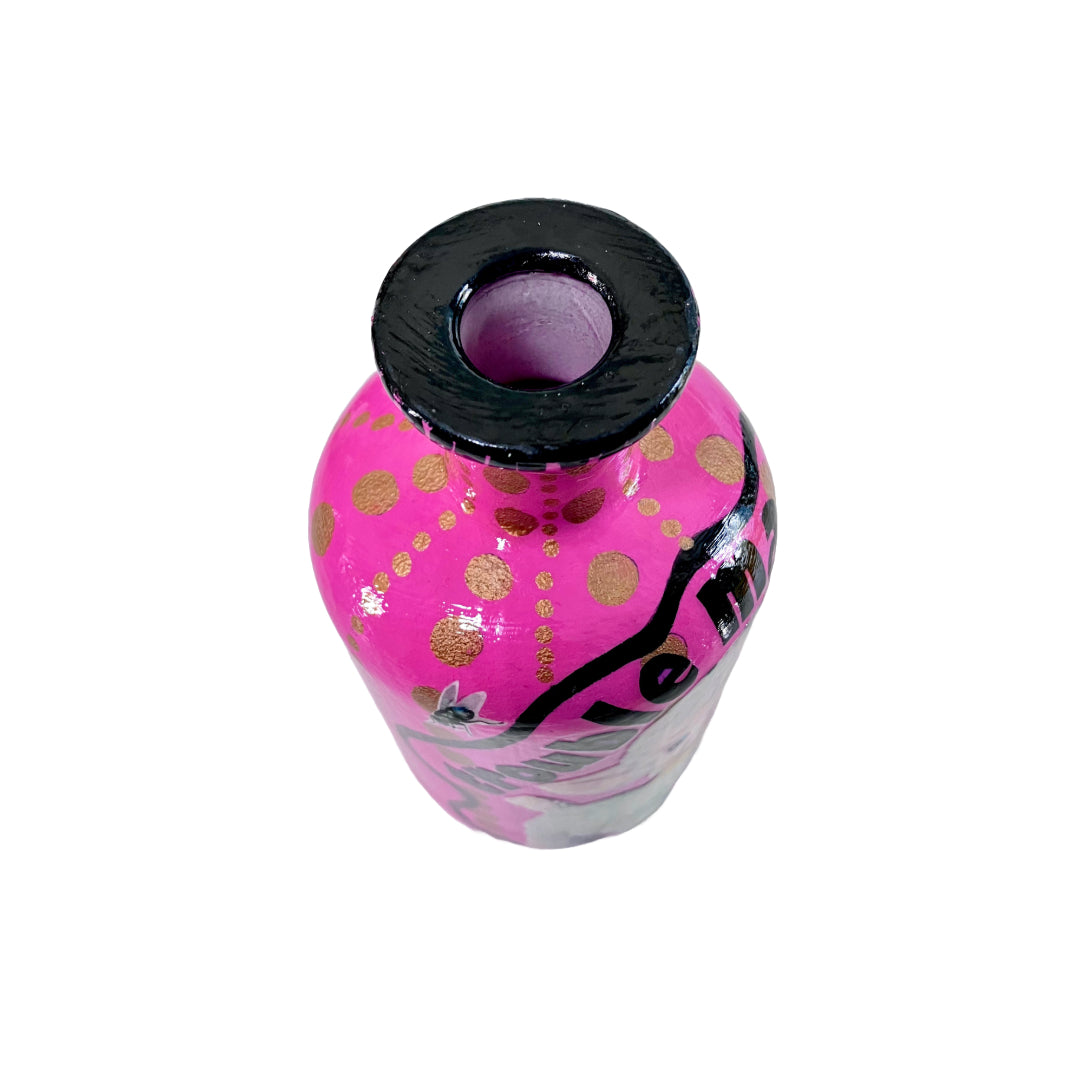 Bright Pink Upcycled Glass Bottle by House of Frisson, featuring an image of a kitsch squeaky lamb toy and some golden dots accent.